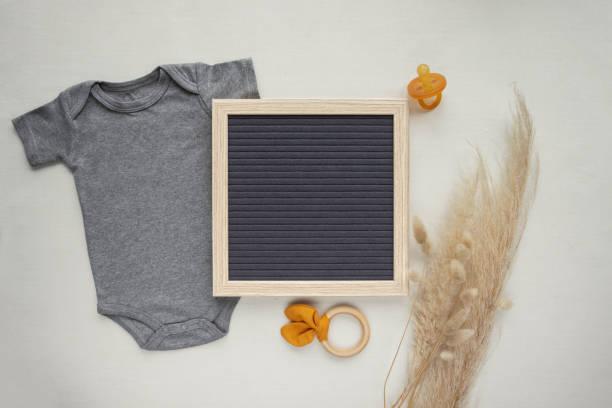 istock Neutral pregnancy announcement flat lay 1403900455