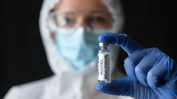 Monkeypox vaccine in doctors hand stock photo