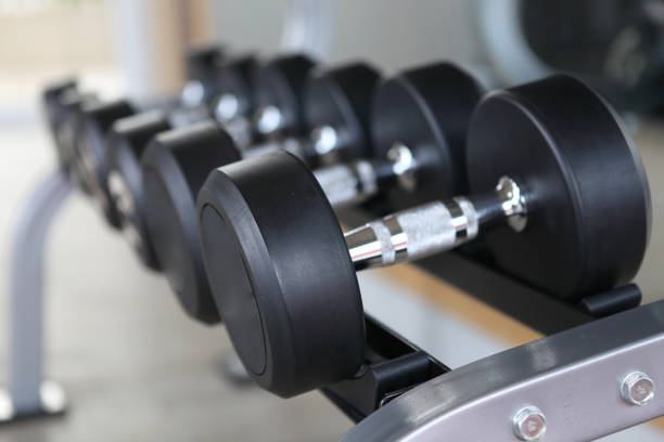 istock dumbbell in fitness room ,select focus 1403907258
