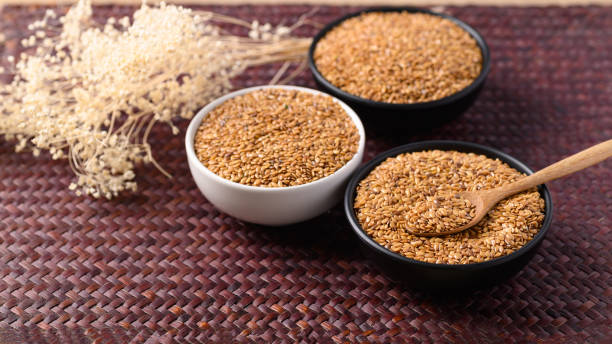 istock Golden flax seed or linseed in bowl with spoon 1403910294