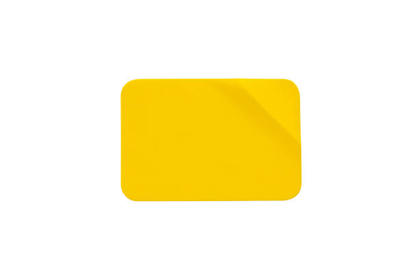 istock Yellow plastic sticker label isolated on white background 1403910464