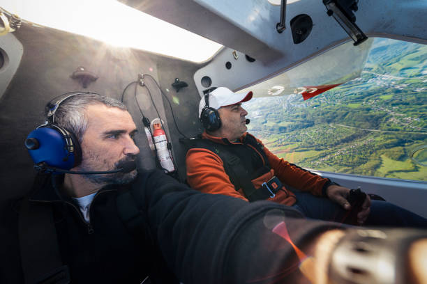 istock Mature men flying with a private airplane at sunrise. 1403910615