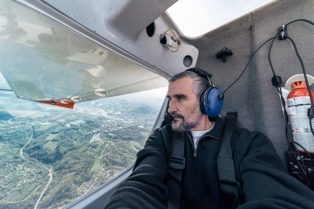 Mature men flying with a private airplane at sunrise.