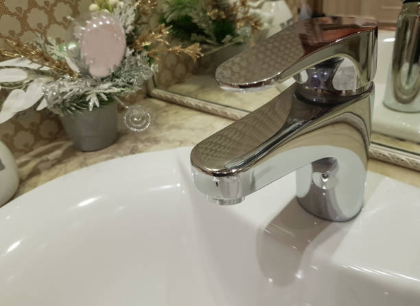 istock Bathroom interior with luxury chrome sink faucet. Modern design 1403910997