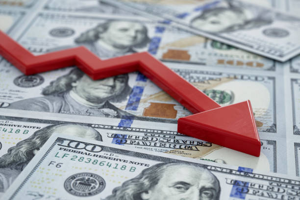 Economic Recession and Market Crash Concept USA enters a bear market and recession concept image of crashing arrow on one hundred dollar bills. lower cost stock pictures, royalty-free photos & images