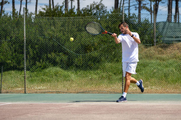 istock Tennis player hitting forehand at ball 1403914587