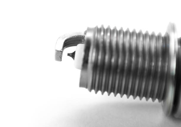 istock The electrode on the new iridium spark plug. Close up. Isolated on a white background 1403929611