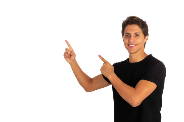 istock Young smiling man pointing with forefingers 1403930293