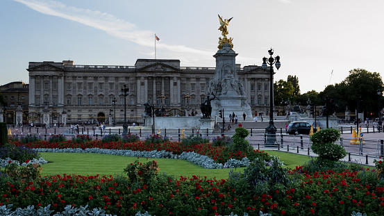 June 1, 2018 - London, England. The front entrance to Buckingham Palace in London, England, with queens guards standing by, beyond the pedestrian fence.