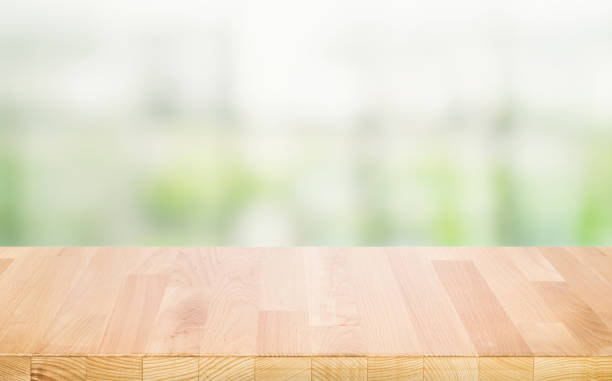 istock Select tive focus.Empty wood table top on blur abstract window glass background 1403933533