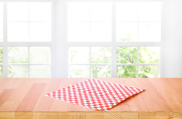 istock Select tive focus.Empty wood table top on blur abstract window glass background 1403933683