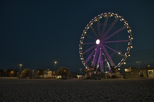Seaside amusement park on the beach. A scenic merry-go-round