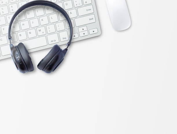 istock Headphone and keyboard on office desk. 1403937153