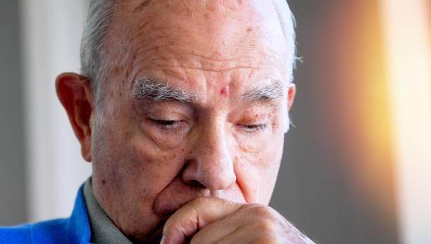 istock Concerned pensive senior hispanic man looking down 1403938407