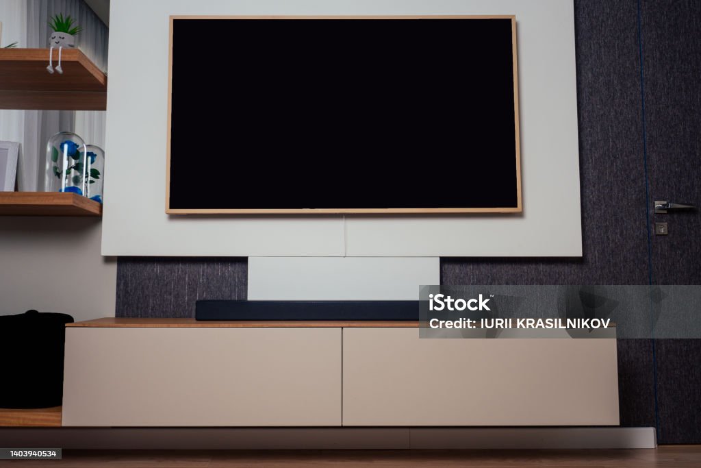 Modern living room with wood floor and home movie theater blurred background Apartment Stock Photo