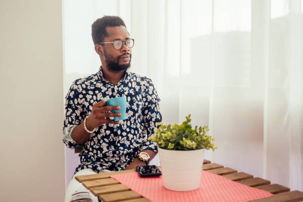 istock african-american friends drinking coffee on the balcony 1403941278