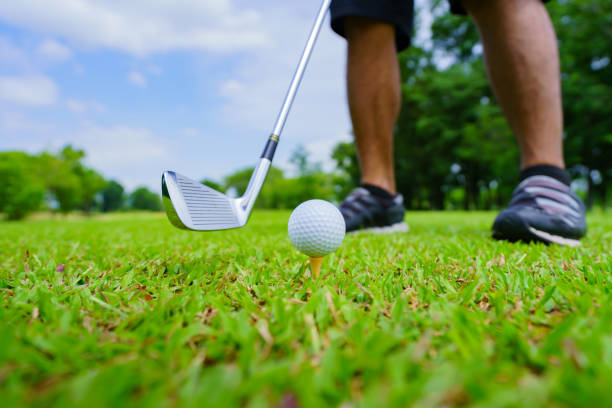 istock Golf ball on green grass ready to be struck on golf course 1403942205