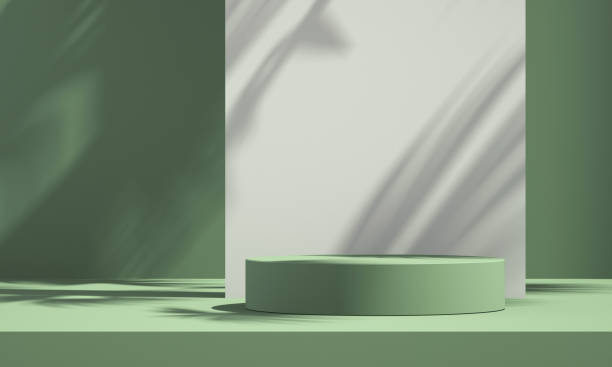 istock 3D green product podium display with green and white background and tree shadow,summer product mockup background,3D render illustration 1403943166