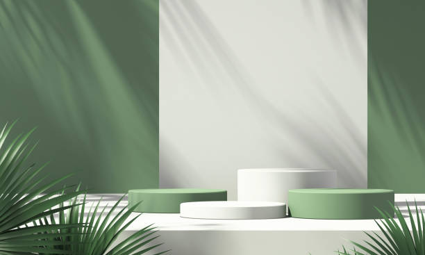 istock 3D green product podium display with green and white background and tree shadow,summer product mockup background,3D render illustration 1403943177
