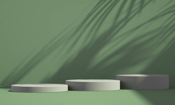 istock 3D green product podium display with green background and tree shadow,summer product mockup background,3D render illustration 1403943207