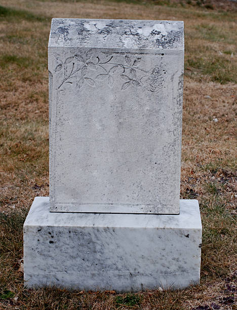 Empty gravestone with rose embellishment stock photo