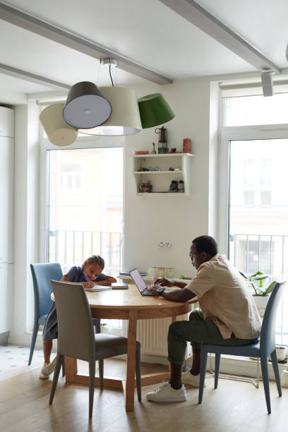 istock Father and Daughter Casual Home Scene 1403951635