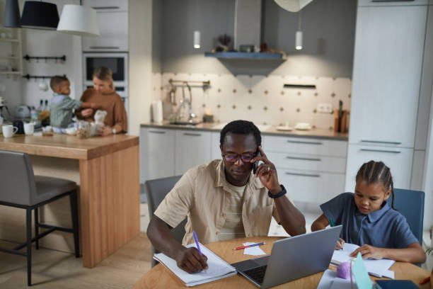 istock Father Working from Home Biracial Family 1403951660