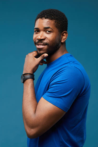 istock Portrait of Handsome Black Man on Blue 1403952380