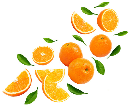 flying sliced orange with green leaf isolated on white background. clipping path