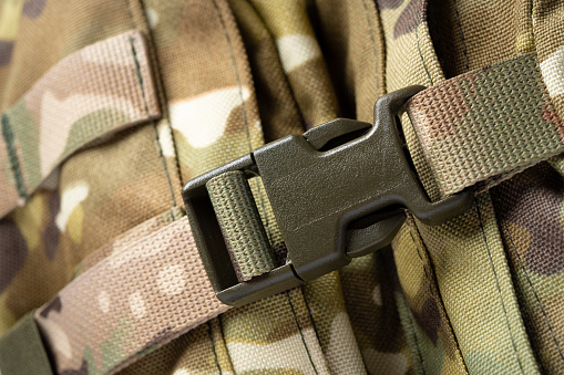 Close up photo still life of a green army tactical backpack
