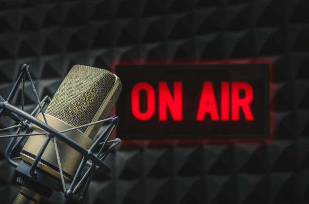 istock Professional microphone and on air sign 1403954750