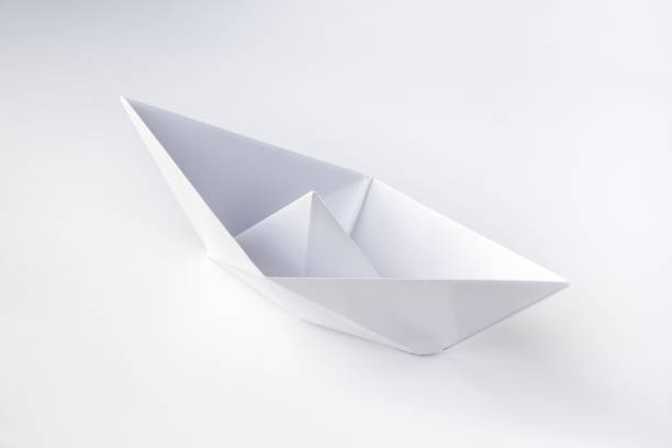 istock Paper boat origami isolated on a white background 1403955321
