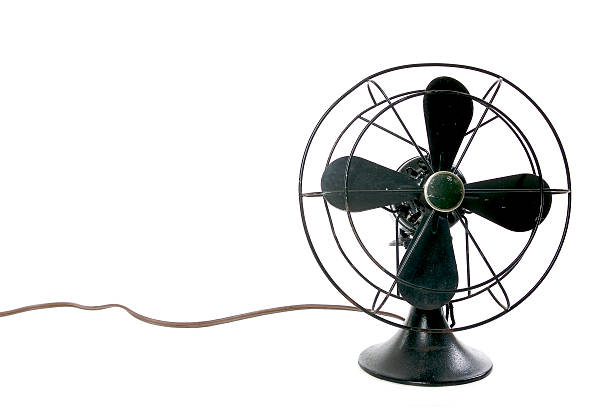 istock Four-blade vintage black desktop fan on white background 140395546