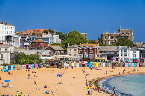 Kent, England - 14 June, 2022 - People enjoying sunshine on the sandy beach at Viking Bay in the seaside town of Broadstiars