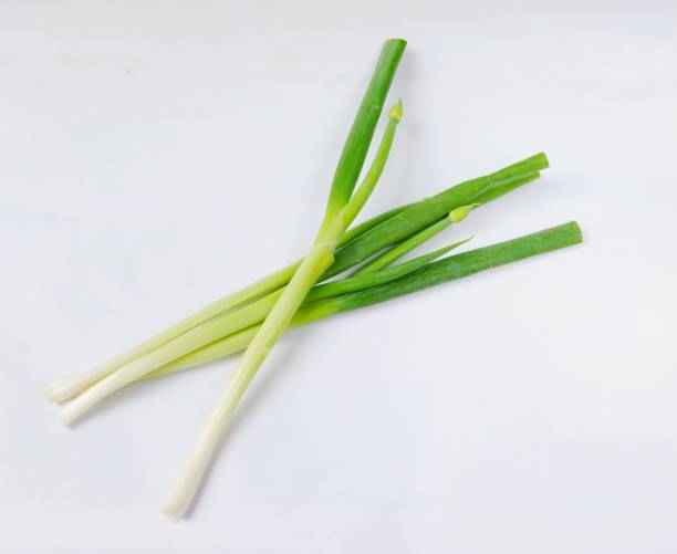 istock Green onions isolated on a white background 1403956958
