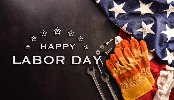 istock Happy Labor day concept. American flag with different construction tools on dark stone background. 1403957330
