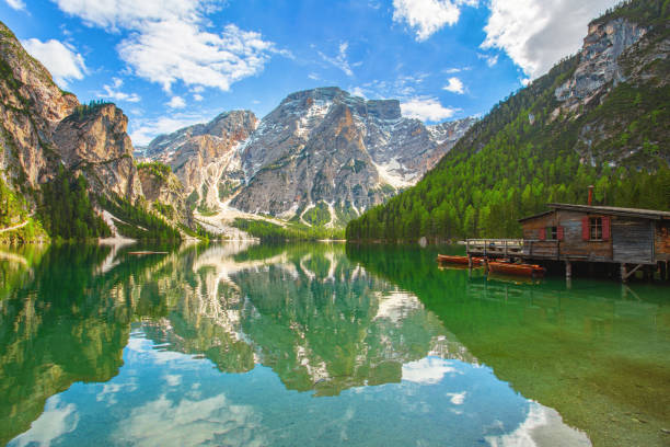 istock Mountain lake with boathouse 1403958026