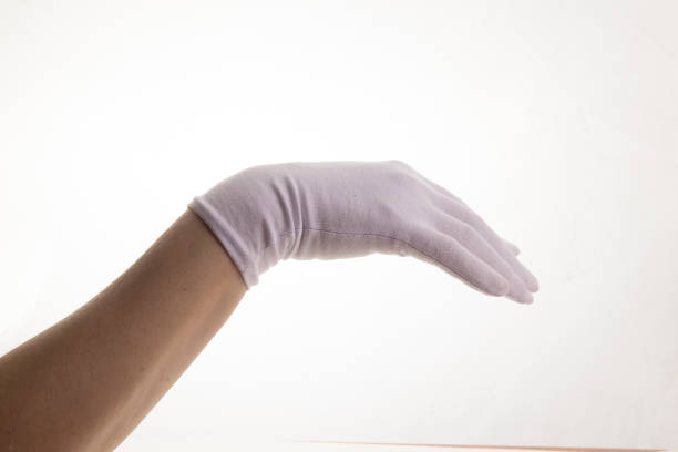 istock Hands gesticulating in white textile gloves on a white background 1403959692