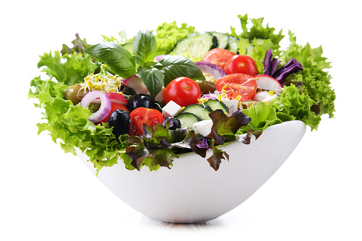 Vegetable salad bowl isolated on white background