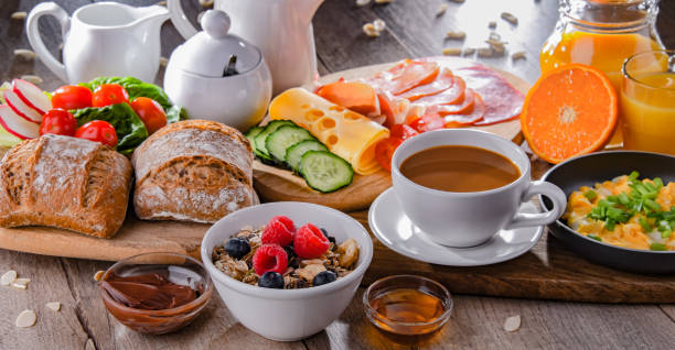 istock Breakfast served with coffee, scrambled eggs, cereals and ham 1403962642