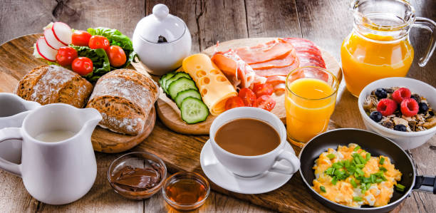 istock Breakfast served with coffee, scrambled eggs, cereals and ham 1403962657