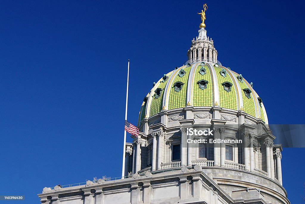 Capitol Dome with flag at half mast This is an image of the state Capitol Dome in Harrisburg, Pennsylvania with the United States (American) flag at half mast due to the passing of President Gerald Ford Pennsylvania State Capitol Stock Photo