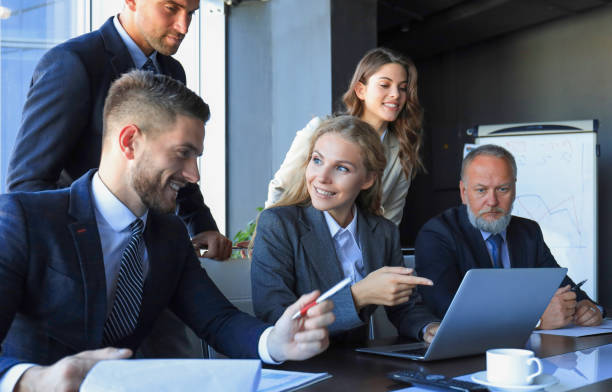 istock Group of business partners discussing ideas and planning work in office. 1403965004