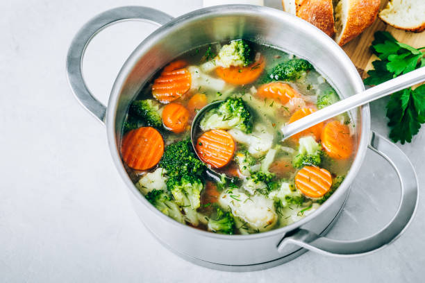 istock Vegetable soup. Spring broccoli, cauliflower, carrots soup in pot. 1403967351