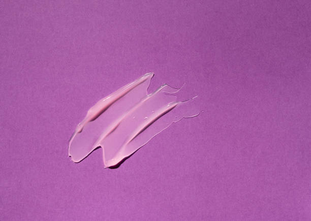 istock Liquid gel cosmetic product on violet background 1403969107