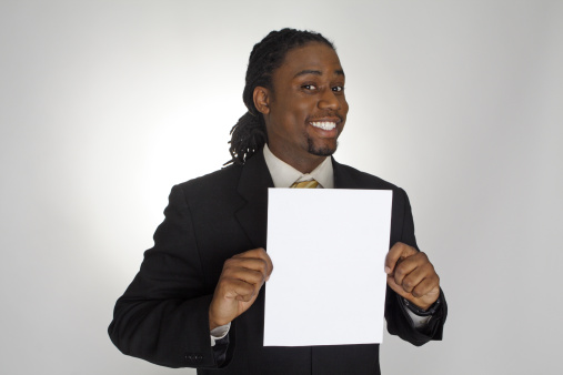 Businessman holding up a sheet of paper with a fake 