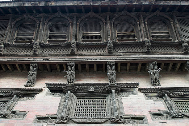Carved wall of a temple, Katmandu, Nepal stock photo