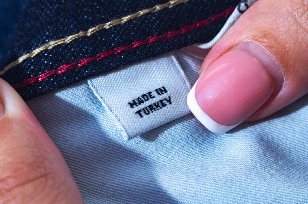 istock Small clothes label showing garment was Made in Turkey. Close-up, selective focus. 1403970617