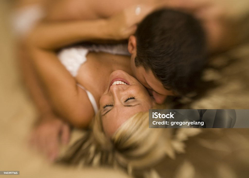 Happy Couple Series Husband and wife share a moment of romantic affection. Taken with Lensbaby. Adult Stock Photo