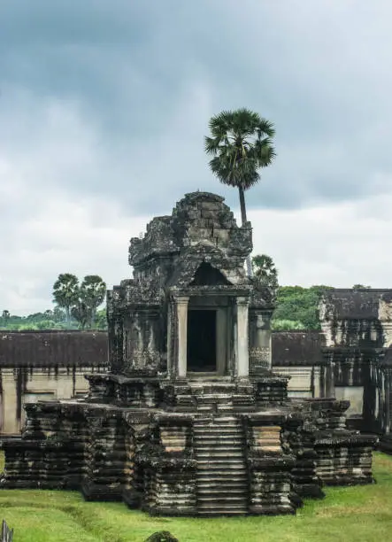 Photo of Small castles or pavilions surround the walls of Angkor Wat in Siem Reap